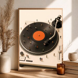 May include: A framed wall art print featuring a cream-colored turntable with a black vinyl record and a bright orange center label. Tiny miniature figures of people are scattered across the surface of the record and the turntable base.