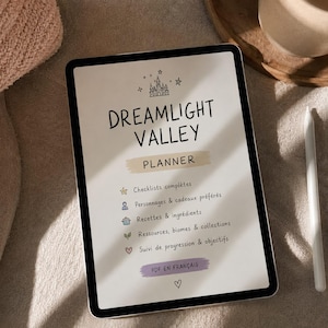 May include: A digital tablet displaying a Dreamlight Valley planner with a castle icon at the top. The text includes Checklists complètes, Personnages & cadeaux préférés, Recettes & ingrédients, Ressources, biomes & collections, Suivi de progression & objectifs, and PDF EN FRANÇAIS.
