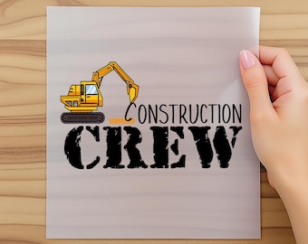 May include: A DTF transfer sheet with the text "FAST DTF TRANSFER" at the top and "READY TO PRESS" at the bottom. The design features a yellow excavator and the words "CONSTRUCTION CREW" in black.