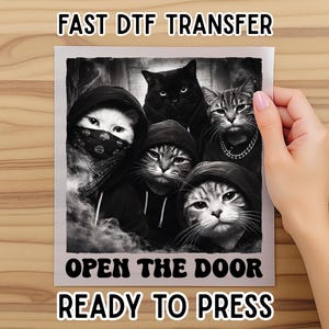 May include: Black and white graphic featuring five cats in hoodies and bandanas. The image includes the text "FAST DTF TRANSFER" and "OPEN THE DOOR READY TO PRESS". The cats have various expressions, with one wearing a bandana.
