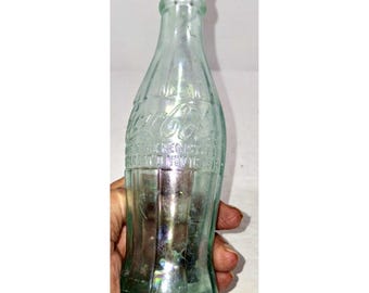 Botella antigua L.C.W. 21 Coca Cola Hobble Skirt, patentada el 16 de noviembre de 1915.