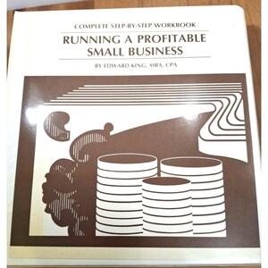 May include: A workbook titled "RUNNING A PROFITABLE SMALL BUSINESS" by Edward King, MBA, CPA. The cover features a brown and white graphic with stacks of coins and abstract shapes. The book is a complete step-by-step workbook.