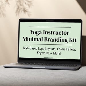 May include: A laptop displays the text "Yoga Instructor Minimal Branding Kit." The screen shows text-based logo layouts, color palettes, keywords, and more. The laptop is open on a light gray surface, with a neutral background.