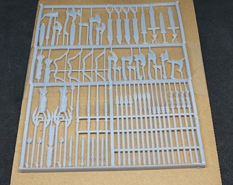 May include: A plastic sprue sheet with 64 pieces of miniature weapons for tabletop role-playing games. The sprue sheet is gray and has a grid pattern. The weapons include swords, axes, spears, and bows. "64 pieces total. Sprue colors may vary. Reaper minis not included."