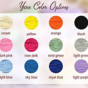 May include: Image displaying yarn color options. The colors include cream, yellow, orange, black, dark pink, rose pink, mint green, light green, light blue, sky blue, royal blue, and light purple. The text "Yarn Color Options" is at the top.