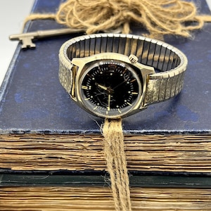 Bulova accutron 14 k gold case - Etsy 日本