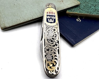 Navaja de bolsillo vintage EKA para caballero con escudo de armas real sueco.