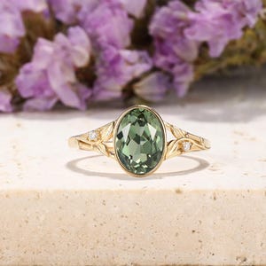 May include: A set of three ceramic mugs with a speckled, matte finish. The mugs are in shades of cream, light gray, and dark gray. Each mug has a simple, minimalist design and a rounded handle.