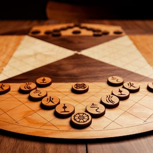 May include: A wooden board game with a circular design and geometric patterns. The game features small, round wooden game pieces with engraved symbols. The board is made of light and dark wood, creating a contrasting visual effect.