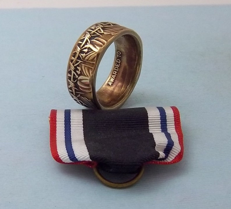 This is a POW Prisoner of War Service medal turned into a size 10 12 ring Wear this on your special occasions.