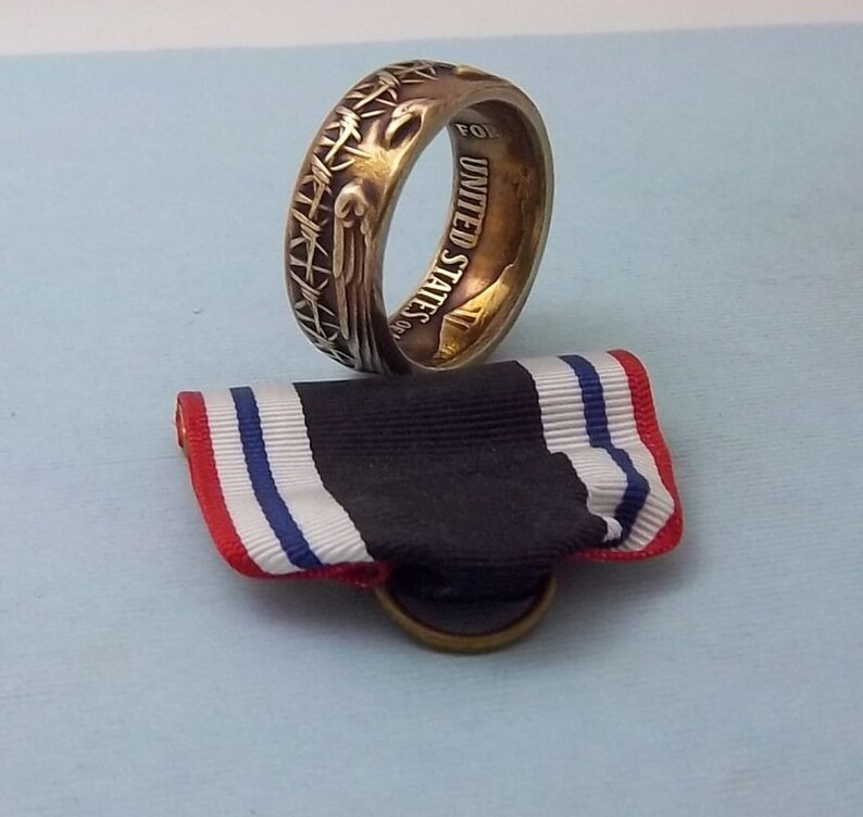 This is a POW Prisoner of War Service medal turned into a size 10 12 ring Wear this on your special occasions.