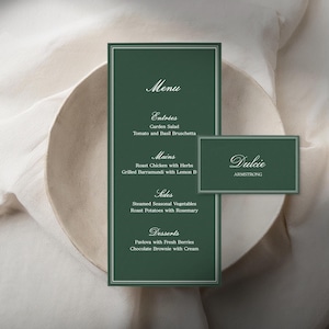 May include: A dark green vertical menu card and a smaller rectangular place card with white text. The menu lists entries, mains, sides, and desserts, while the place card displays the name Dulcie Armstrong in a white serif font.