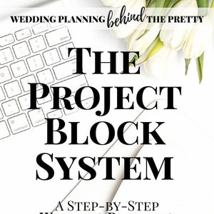 May include: A white keyboard, white tulips, and text that reads "WEDDING PLANNING behind THE PRETTY THE PROJECT BLOCK SYSTEM." The image promotes a step-by-step wedding planning e-course.