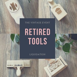 May include: Four craft punches for paper crafting. The punches are white with gold accents and feature designs of a monogram, a cupcake, a lace border, and a butterfly. The punches are displayed on a wooden surface with green plants in the background. The text "THE VINTAGE EVENT RETIRED TOOLS LIQUIDATION CRAFT TOOLS & PUNCHES THAT NEED A NEW HOME!" is displayed on a blue background.