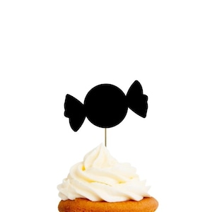 May include: Black silhouette of a candy on a white background. The candy is on a toothpick and is placed on top of a frosted cupcake.