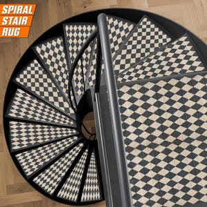 May include: Spiral staircase rug with a black and white checkered pattern. The rug covers the steps of a spiral staircase, with a black metal railing. The text "SPIRAL STAIR RUG" is in the upper left corner.