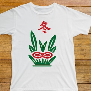 May include: White t-shirt featuring a green and red graphic design. The design includes a stylized plant with a red double-oval shape and the red Chinese character for "winter" at the top. The shirt is made of a soft material.