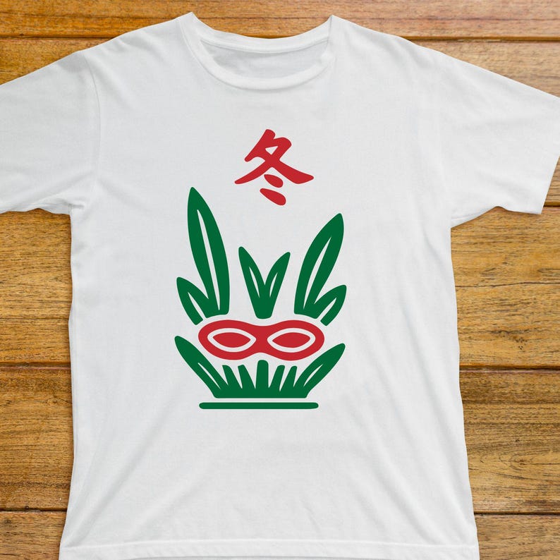 May include: White t-shirt featuring a green and red graphic design. The design includes a stylized plant with a red double-oval shape and the red Chinese character for "winter" at the top. The shirt is made of a soft material.