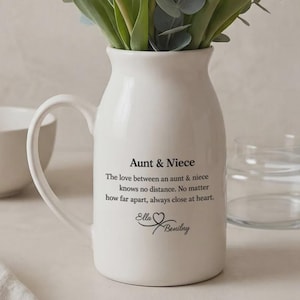 May include: A set of three ceramic mugs with a speckled, matte finish. The mugs are in shades of cream, light gray, and dark gray. Each mug has a simple, minimalist design and a rounded handle.