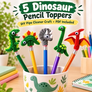 May include: Five dinosaur pencil toppers crafted from pipe cleaners, featuring a green T-Rex, a green Stegosaurus, a gray Triceratops, a green long-necked dinosaur, and a red Pterodactyl. Text reads: 5 Dinosaur Pencil Toppers DIY Pipe Cleaner Craft PDF Included.