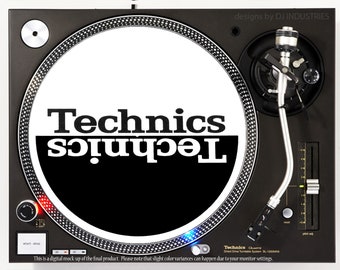 May include: A black and white turntable slipmat with the word "Technics" printed in white on a black background. The slipmat is designed to fit a standard 12-inch turntable.
