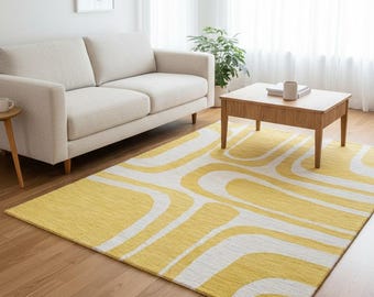 May include: A living room scene featuring a cream-colored sofa, a wooden coffee table, and a vibrant yellow rug with a white, wavy pattern. The room has white curtains and a framed abstract art piece on the wall.