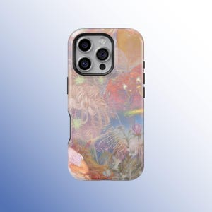 May include: A phone case with a vibrant, artistic design. The case features a detailed illustration with a woman, flowers, and abstract elements in shades of pink, orange, and blue. The case has a glossy finish and a protective bumper.