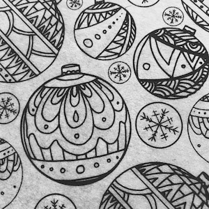 May include: Black and white illustration of Christmas ornaments with intricate designs. The ornaments are surrounded by snowflakes.