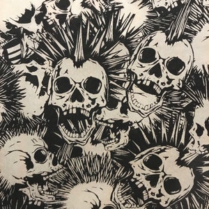 May include: Black and white illustration featuring a pattern of skulls with spiky mohawks. The skulls have open mouths and visible teeth, creating a punk rock or gothic aesthetic. The design is repeated across the image.