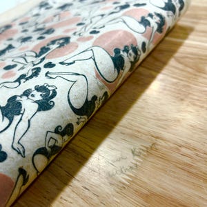 May include: A set of three ceramic mugs with a speckled, matte finish. The mugs are in shades of gray, white, and black. Each mug has a simple, modern design and a rounded handle. The mugs are likely for coffee or tea.