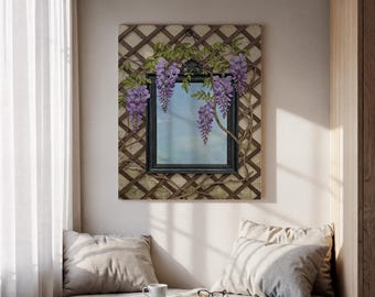May include: A framed wall art piece featuring a black framed mirror with a trellis design. The artwork is adorned with purple wisteria flowers and green leaves. The artwork is hanging on a light-coloured wall.