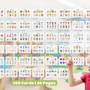 May include: Educational flashcards with colourful illustrations, including fruits, vegetables, food, people, and clothing. The cards are arranged on a wall, with a child pointing at a colour chart. The text "368 Cards | 46 Pages" is visible.