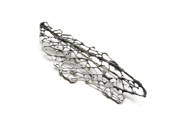 Large silver brooches and cheap pins