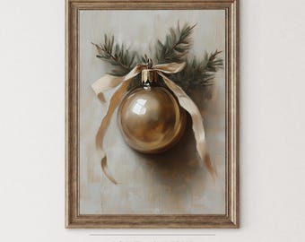 May include: A framed art print depicting a gold Christmas bauble with a ribbon and pine sprigs. The artwork has a vintage style with muted colours and a gold frame. The text "ISLE & PINE ART COLLECTION" is at the bottom.