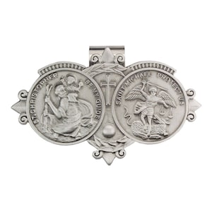 May include: Silver tone metal pendant with three round medallions. The medallions feature images of Saint Christopher, Saint Michael, and a cross. The text "Saint Michael Protect Us" and "Be My Guide" are inscribed on the medallions.