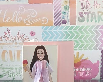 May include: A greeting card featuring a paper cutout of a person with long dark hair, wearing a light purple and pink jacket over a purple skirt, white patterned leggings, and purple shoes, holding a pink ice cream cone on a light pink background.