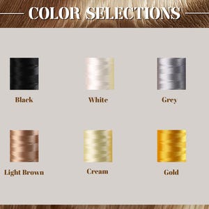 May include: Image showing six thread spools in black, white, grey, light brown, cream, and gold. The text "COLOR SELECTIONS" is at the top. The spools are arranged in two rows of three, each with a colour name below.