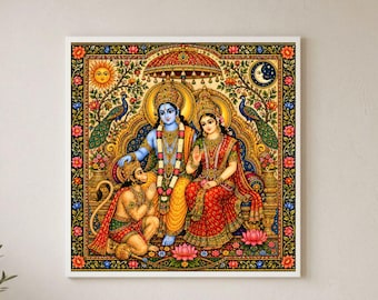 May include: A square wall art print featuring a vibrant illustration of Hindu deities Rama and Sita seated with Hanuman kneeling before them. The artwork is framed in a decorative border with floral motifs, peacocks, a sun, and a crescent moon.