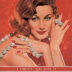 May include: A book cover featuring a woman with auburn hair, red nail polish, and a pearl necklace. The text reads: a complete 1950s guide to vintage makeup, hairstyling & beauty techniques, westmore beauty book, set against a red background.