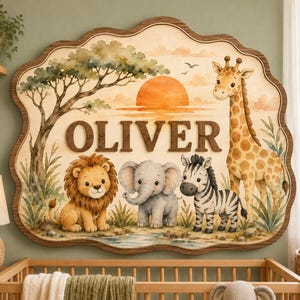 May include: A wooden wall sign with a scalloped edge featuring the name OLIVER in raised letters. The illustration depicts a sunset over a landscape with a lion, an elephant, a zebra, and a giraffe standing near a tree and a small stream.
