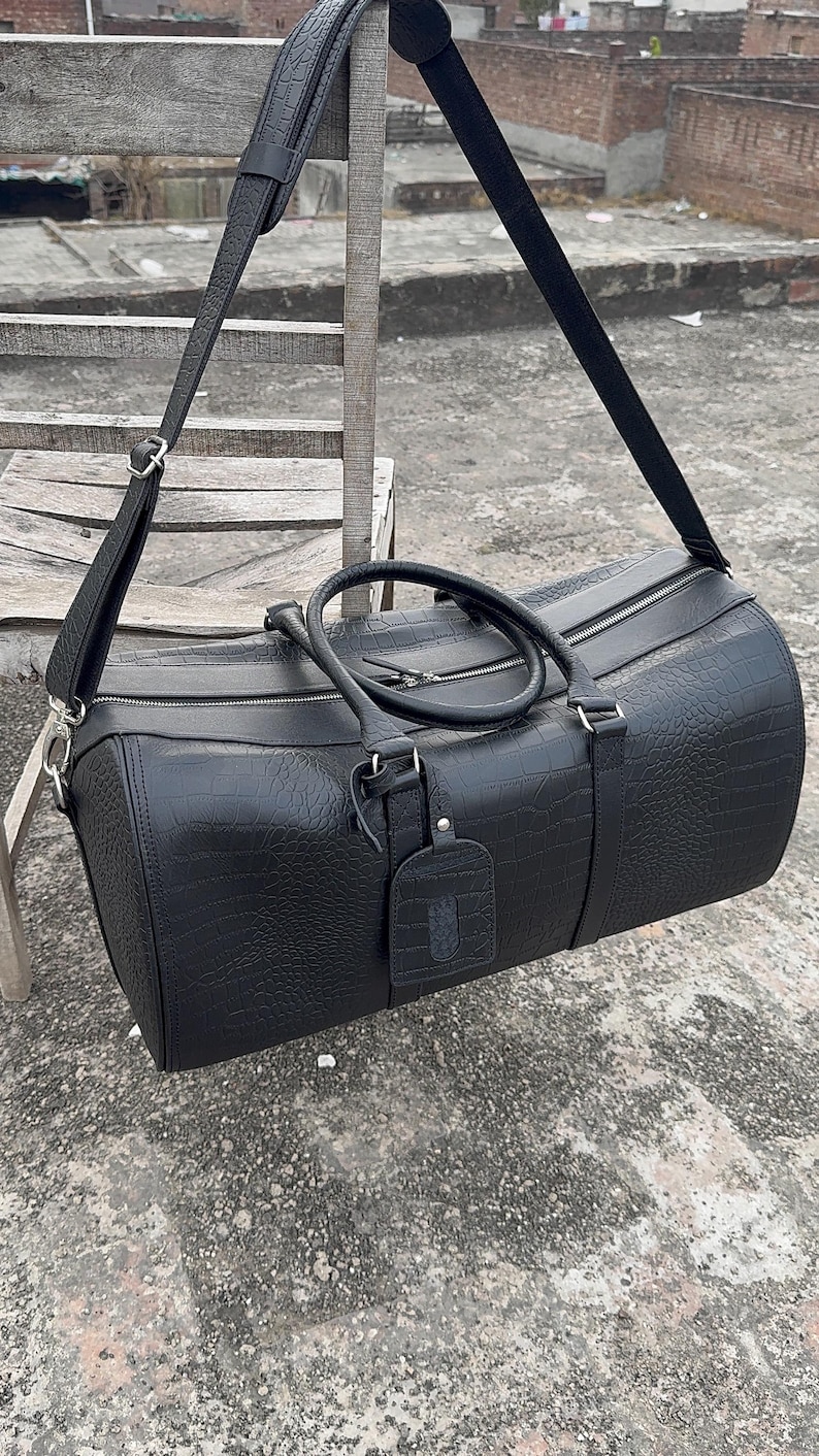 Durable Duffle Bags in Crocodile leather finish for stylish travel.