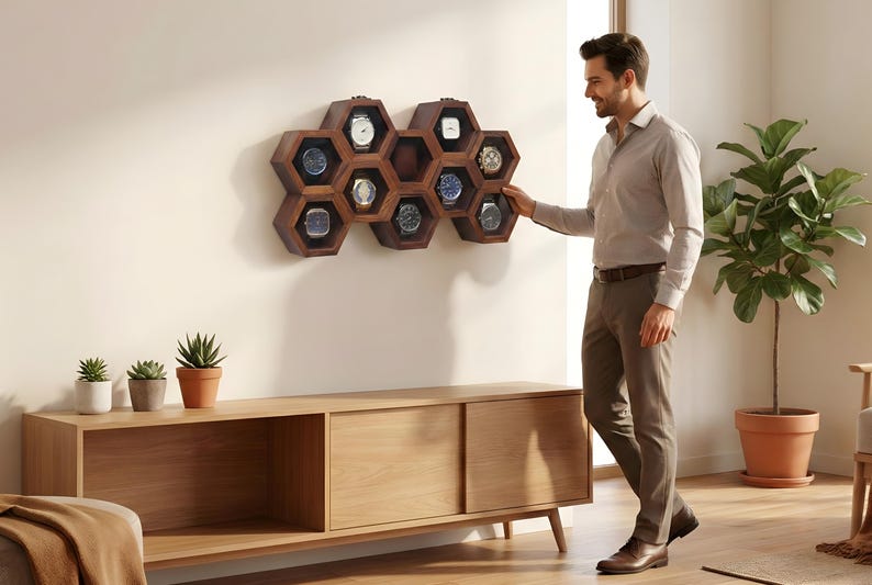 May include: Wall-mounted wooden watch box with a honeycomb design. The box is made of light and dark wood and displays several watches. The text "Wall Mounted Wooden Watch Box" is above the box.
