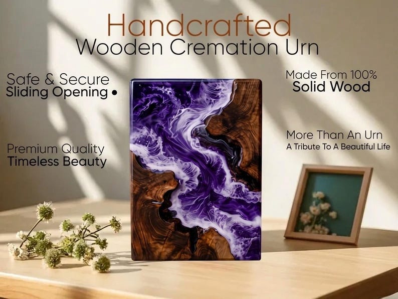 May include: Handcrafted wooden cremation urn with a unique design. The urn features a combination of dark wood and a swirling purple and white resin. The text on the image reads: "Safe & Secure Sliding Opening" and "Made From 100% Solid Wood."