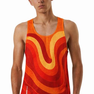 May include: Orange vest top featuring a retro wave design in red and yellow hues. The sleeveless top has a scoop neck and a white vertical stripe on the side. The design has a 1970s aesthetic.