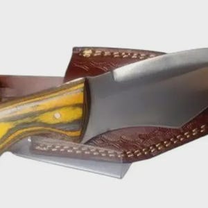11.*Hunting knife with carbon steel blade, original 2-edged shape, exotic wood handle and custom-made leather sheath