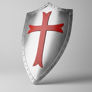 May include: A silver-colored heater shield featuring a prominent red cross emblem centered on its surface. The shield has a metallic finish with a reinforced border secured by a series of evenly spaced rivets along the entire outer edge.