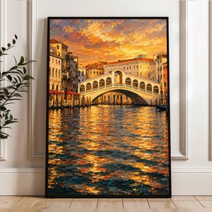 May include: A vertical framed wall art print depicting the Rialto Bridge in Venice at sunset. The painting features thick, textured brushstrokes in shades of orange, yellow, and deep blue, capturing the bridge, surrounding buildings, and water.