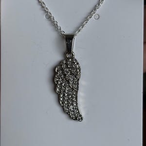 Angel wing necklace with 18” sterling silver chain.