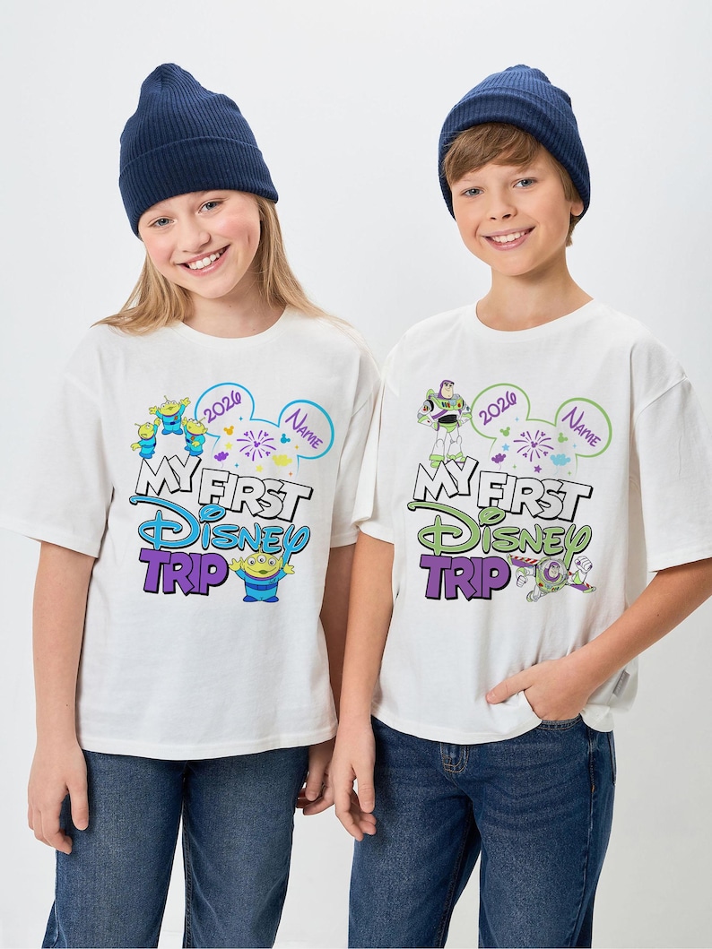 May include: A white ceramic mug with a black handle and the text "But First, Coffee" in a handwritten style. The mug is on a white surface. The mug is approximately 4 inches tall.