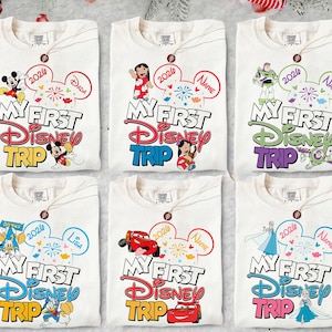 May include: Six white t-shirts with Disney character graphics. Each shirt features "My First Disney Trip" text, a Mickey Mouse ear design, and a character like Mickey, Stitch, Buzz Lightyear, Donald Duck, Lightning McQueen, or Elsa.